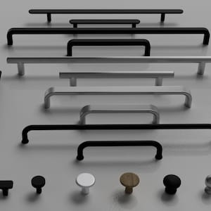 May include: An assortment of cabinet hardware, including black and silver handles and knobs. The handles vary in length, and the knobs come in black, white, wood-tone, and silver finishes. Ideal for kitchen or bathroom renovations.