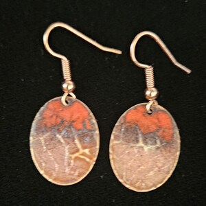 Red enaml on copper dangly earrings, medium. Handmade by A Touch Of Metal Jewelry.