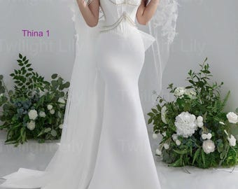 Abito da sposa a sirena in raso bianco con spalle scoperte, perline, fiocco sul retro e vita basca
