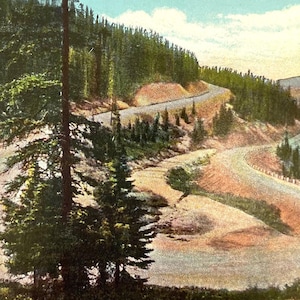 May include: Vintage postcard featuring switchbacks on the Western Slope of Berthoud Pass on U.S. 40 (Victory Highway) in Colorado. The image shows a winding road through a mountainous landscape with lush green trees and a clear blue sky. The postcard is a nostalgic piece of Americana.