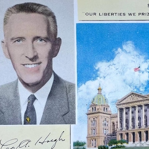 May include: A vintage postcard featuring a color photograph of the Iowa State Capitol Building. The building is a large, white structure with a golden dome. The postcard also features a portrait of the governor,  "R.A. Hoegh", and the state motto, "Our Liberties We Prize and Our Rights We Will Maintain."