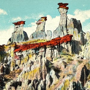 May include: A vintage postcard featuring a colorful landscape with three tall, thin rock formations. The formations are topped with red, white, and blue accents. The rock formations are surrounded by a red, orange, and yellow landscape.