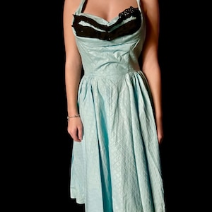 Stunning 1950s turquoise and black petal bust halter party dress.