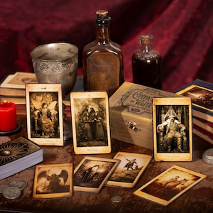May include: A set of tarot cards with vintage imagery, including a Queen of Wands, The Lovers, and The Tower cards. The cards are laid out on a wooden table with a red candle, a silver chalice, and two glass bottles.