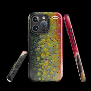 May include: A phone case featuring a colorful illustration of a brown trout. The design includes shades of green, yellow, red, and brown, with a detailed depiction of the fish's markings. The case is shown from multiple angles against a black background.