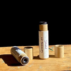 SMOKE LIP THERAPY sheer black iron oxide + plant organic lipstick in compostable packaging! (0.15 oz paperboard tube)
