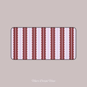 May include: Rectangular decorative design with vertical stripes in burgundy, white, and lavender. The burgundy stripes have a scalloped edge. The design is set against a light mauve background. The text "Hope's Design Haus" is at the bottom.