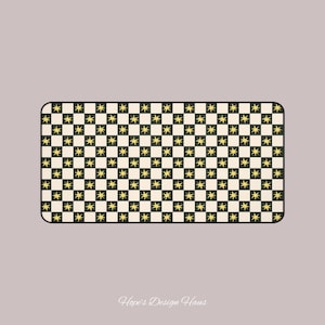 May include: Rectangular decorative mat with a black and cream checkered pattern. Each square features a gold star design. The mat has rounded corners and the text "Hope's Design Haus" at the bottom.