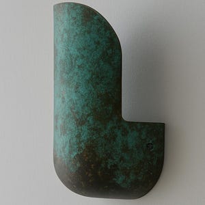 May include: A wall-mounted, curved, metal light fixture with a green patina finish.