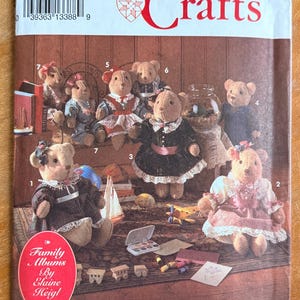 May include: Simplicity Crafts pattern featuring teddy bears in various outfits. The pattern cover includes the text "Family Albums By Elaine Heigl" and the number "8155". The bears are dressed in dresses, sweaters, and sailor suits.