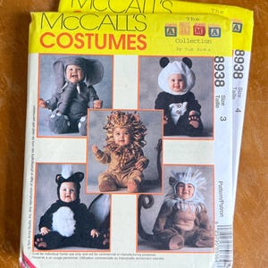 May include: Two McCall's Costumes sewing patterns from The Arma Collection by Tom Arma, numbered 8938. The packaging features photographs of children wearing animal costumes including an elephant, panda, lion, skunk, and monkey, with size 3 and 4 labels.