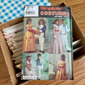 May include: Simplicity pattern number 7978 for costumes. The pattern includes four different costumes: a princess, a prince, a colonial dress, and a colonial suit. The pattern is for sizes 7-14.