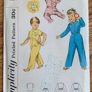 May include: Vintage Simplicity sewing pattern 3377 for toddler pajamas. The pattern includes three different styles of pajamas, one with a lamb applique, one with a blue jumpsuit, and one with a yellow jumpsuit. The pattern is printed on white paper with black text and illustrations.