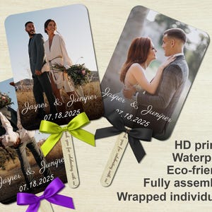 May include: Three wedding fan favors with photos of a couple, the names "Jasper & Juniper", and the date "07.18.2025". Each fan has a ribbon in green, purple, or black. The fans are HD printed, waterproof, eco-friendly, fully assembled, and wrapped individually.