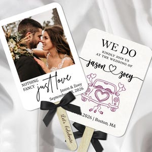 May include: Two wedding fans with black bows. One fan has a photo of a couple and the text "NOTHING FANCY just love" with wedding details. The other fan says "WE DO" with the couple's names and a car illustration.