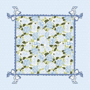 May include: A square floral pattern with blue and white hydrangea flowers and green leaves. The pattern is framed by a light blue border with a scalloped edge and bows at each corner. The background is light blue with white polka dots.