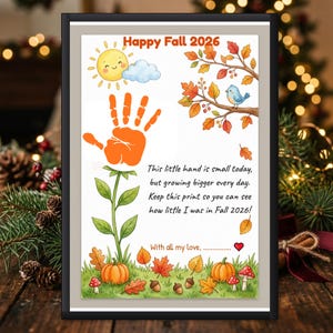 May include: A framed print titled Happy Fall 2026 featuring a cartoon sun, a blue bird on a branch, and an orange handprint shaped like a flower. The text reads: This little hand is small today, but growing bigger every day. Keep this print so you can see how little I was in Fall 2026! With all my love, followed by a red heart.