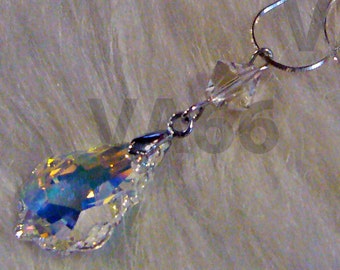 May include: A silver chain necklace with a clear crystal teardrop pendant and a smaller crystal charm.