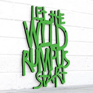 May include: Green wooden sign with the text "Let the Wild Rumpus Start" in a bold, stylized font.