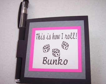 Bunko sticky note holder. pink, gray, black with gel pen.