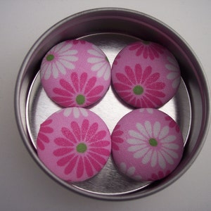 Set of four pink daisy fabric covered button refrigerator magets in round window top tin