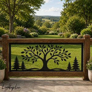 May include: A rectangular black metal railing insert featuring a laser-cut design of a central deciduous tree flanked by two pine trees on each side. The panel is framed by a wooden railing structure and includes the text Lightup lux.