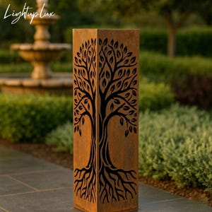 May include: A tall, rectangular, outdoor metal sculpture with a tree design. The sculpture is made of weathered, rust-coloured metal. A black tree silhouette is cut out of the metal, showing the tree's trunk, branches, and roots. The sculpture is in a garden setting.