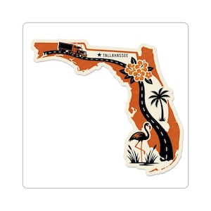May include: A sticker in the shape of Florida with a road, truck, and flamingo design. The sticker has a vintage aesthetic with a brown and cream color scheme. The word "Tallahassee" is printed on the sticker.
