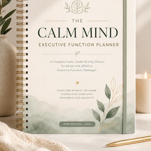 May include: A spiral-bound planner titled The Calm Mind Executive Function Planner with a cream cover, gold wire binding, and green watercolor accents. The cover features a brain icon, leaf illustrations, and text regarding ADHD support.