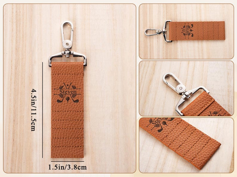 May include: A tan textured leather keychain with a silver metal swivel clasp. The keychain features a black engraved design of two crossed golf clubs, a golf ball, and the name Steven. It measures 4.5 inches in length and 1.5 inches in width.
