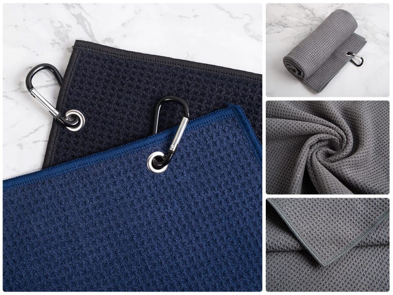 May include: Three microfiber towels with a waffle texture in black, blue, and gray. Each towel has a metal carabiner clip attached.