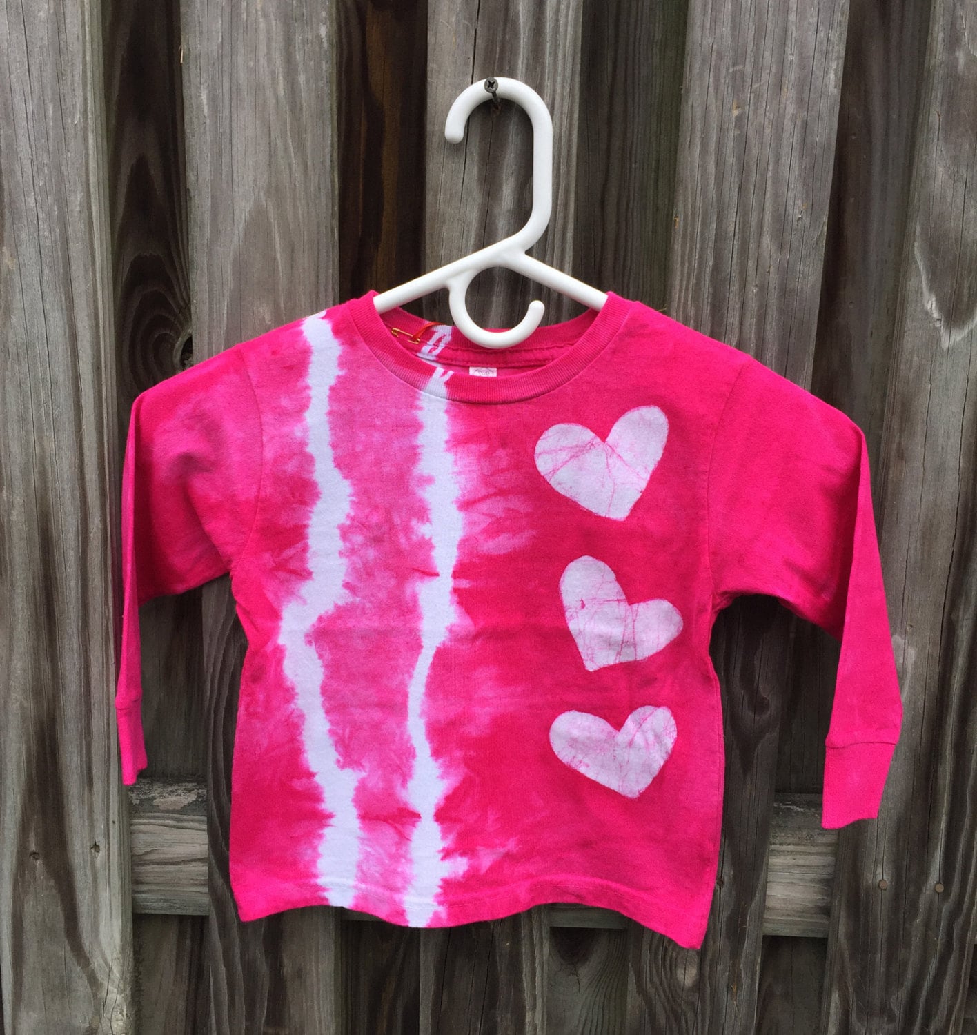 red and pink tie dye shirt