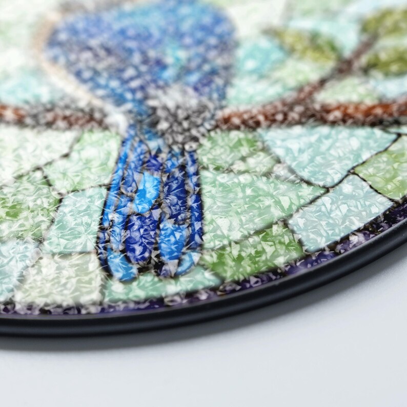 a plate with a blue bird painted on it