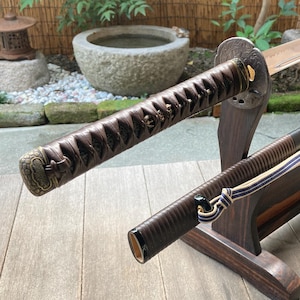 High quality &quot;iaito&quot; training katana crafted with original 17th century decorations. Ancient handguard marked by an enemy stroke.