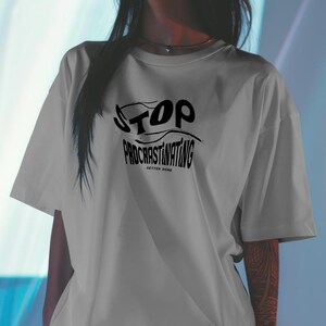 May include: Gray t-shirt with black text that reads "STOP PROCRASTINATING GETTER DONE".