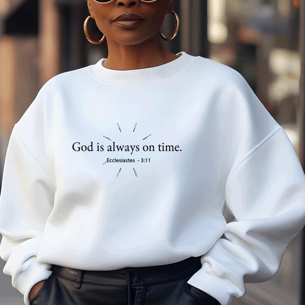 May include: White sweatshirt with the text "God is always on time. - Ecclesiastes 3:11" printed on the front.