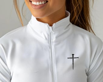 May include: White zip-up jacket with a high collar and a black cross and nail design on the chest. The jacket has a full zipper and a smooth texture. The design is a simple, yet elegant, religious symbol.