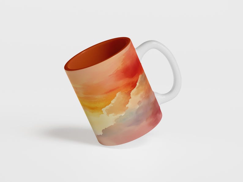 K&ouml;nnte beinhalten: Wei&szlig;e Keramiktasse mit einem farbenfrohen Sonnenuntergangsdesign. Die Tasse hat ein Aquarell-Design in Rot, Orange, Gelb und Lila.