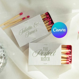 May include: Two rectangular matchboxes with light gray and white vertical stripes. One box features the text Juliette & James, and the other displays the text The Perfect Match. Both boxes are filled with wooden matches that have pink tips.