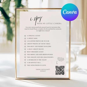 May include: A framed wedding sign with the text "i spy with my little camera" and a list of moments to capture. The sign is in a gold frame and includes a QR code. The Canva logo is in the upper right corner.