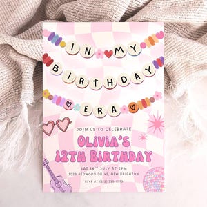 May include: A pink birthday invitation with the text "IN MY BIRTHDAY ERA" and "OLIVIA'S 12TH BIRTHDAY". The invitation includes a guitar, heart-shaped glasses, and a disco ball illustration. The date and time are also included.