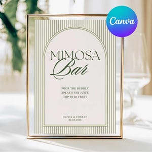 May include: A gold-framed sign with the words "MIMOSA Bar" in a stylish font. The sign includes the text "Pour the bubbly, splash the juice, top with fruit." The names "Olivia & Conrad" and the date 04.05.2026 are also displayed.