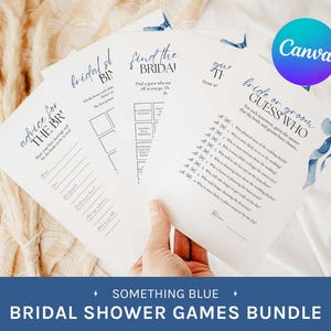 Peut inclure: Un ensemble de jeux pour une fête prénuptiale sur papier blanc, tenu par une main. Les jeux incluent "Advice for the BR", "Bridal Bingo", "Find the BRIDA!", et "Bride or Groom Guess Who". Le texte "SOMETHING BLUE BRIDAL SHOWER GAMES BUNDLE" est en bas.