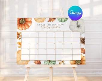 May include: A baby shower calendar with a fall theme. The calendar features watercolor pumpkins, leaves, and the text "Guess the Birthday Baby Foster." The calendar is displayed on a wooden easel.