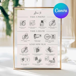 May include: A framed print with gold trim, displaying instructions on how to take a photo, take a selfie, and load new film. The print includes illustrations of cameras and text. A Canva logo is in the upper right corner.