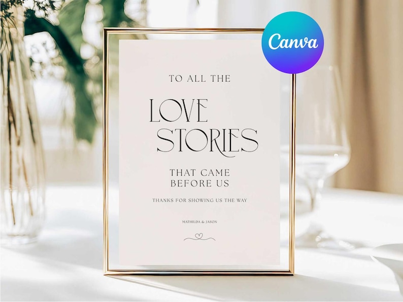 May include: A framed sign with gold trim and a white background. The sign reads "TO ALL THE LOVE STORIES THAT CAME BEFORE US." The Canva logo is in the upper right corner. The sign is likely for a wedding or special event.