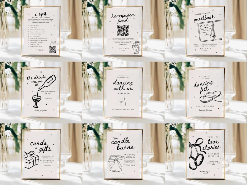 May include: A collection of framed signs with gold borders, featuring black text and illustrations on a cream background. The signs include phrases like "I Spy," "Honeymoon Fund," "Guestbook," "Dancing with Us," and "Cards + Gifts," suitable for a wedding or event.