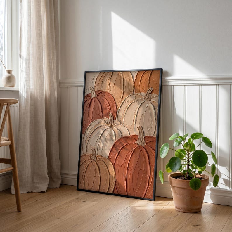May include: A rectangular framed wall art piece featuring a textured impasto painting of multiple pumpkins in shades of burnt orange, cream, and beige. The artwork displays thick, visible brushstrokes creating a raised surface effect on the canvas.