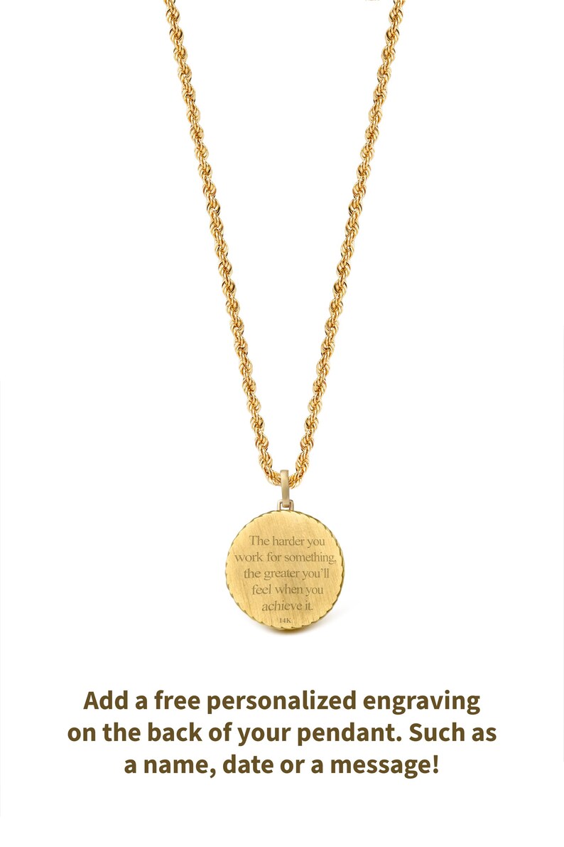 May include: Gold-colored necklace with a round pendant. The pendant has the engraved text: "The harder you work for something, the greater you'll feel when you achieve it." The necklace chain is a rope style.