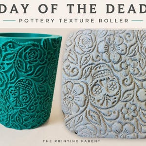 May include: A teal cylindrical pottery texture roller featuring a Day of the Dead pattern with skulls and flowers, alongside a light grey clay slab embossed with the same intricate floral and skull design. Text reads DAY OF THE DEAD POTTERY TEXTURE ROLLER.
